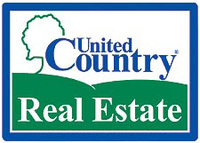 CAROLAN AND COMPANY REAL ESTATE Logo