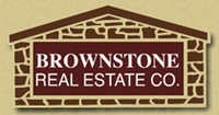 BROWNSTONE REAL ESTATE CO. Logo