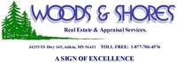 WOODS & SHORES REAL ESTATE, INC. Logo