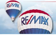 RE/MAX Suburban, Inc Logo