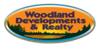 WOODLAND DEVELOPMENTS & REALTY Logo